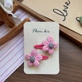 Detail of pink houndstooth flower hair clips with checkered center on display card - Pink Houndstooth Flower Hair Clip