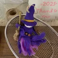 Detailed macro shot of a handmade purple felt witch pendant with a wooden broomstick accessory - Purple Hat Witch Pendant