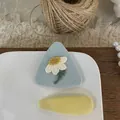Detailed shot of Korean style blue fabric hair clips with embroidered daisy and yellow drop - Triangle Floral And Teardrop