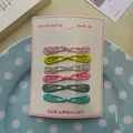 Set de 12 mini horquillas para niñas con estampados florales y de cuadros de colores - Green System