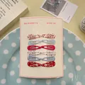 Lot de 12 barrettes en métal imprimé avec motifs à pois et fleurs sur cartonnette - Série Rouge