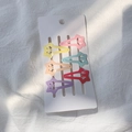 Lot de six barrettes étoiles aux couleurs macaron sur carte de présentation - Style Étoile