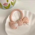 Pink and white gradient bow hair tie with ribbed fabric texture on a shell plate - Gradient Khaki