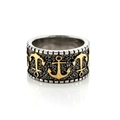 Detailed macro view of retro punk steel ring with golden anchor reliefs and textured surface - US 8 / Two-tone (Gold & Silver)