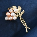 Elegant gold flower brooch with seven freshwater pearls in white pink and champagne tones - Freshwater Pearl Bouquet