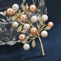 Exquisite gold twig brooch with multi-colored pearls and zircon crystals on blue background - Branch Freshwater Pearl