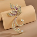 Elegante spilla a forma di fenice d'oro con zirconi rosa e champagne sul supporto - Rosso