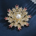 Elegant snowflake brooch with large pearl and pink zircon accents on gold base - Red