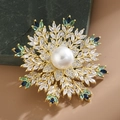 Snowflake brooch with gold base, white pearl, and blue green zircon crystal inlay - Green