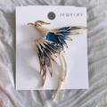 Exquisite gold-plated phoenix brooch with blue enamel wings and synthetic crystals - Blue