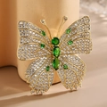 Elegante spilla a farfalla con micro-pavé di zirconi e pietre preziose verde smeraldo - Verde Smeraldo