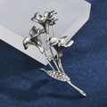 Macro shot of silver calla lily brooch with matte finish and sparkling rhinestones - Morning Glory Beaded Style