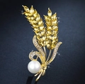 Elegante spilla a spiga di grano con cristalli gialli, perle bianche e finitura dorata - Lega Oro