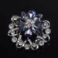 Macro detail of crystal flower brooch with blue pear-cut petals and silver metal accents - Deep Blue Pear Cut Crystal Style (5)