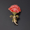 Elegant red carnation brooch with gold trim and green rhinestone bow detail - Brick Red