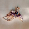 Elegant gold phoenix brooch featuring purple enamel wings and sparkling crystal rhinestones - Purple