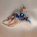 Broche phénix dorée élégante avec ailes en émail bleu et détails en cristal brillant - Bleu