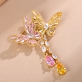 Elegante spilla a farfalla placcata oro con cristalli colorati e lunghi ciondoli a nappa - Oro