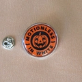 Detail of Motionless In White Halloween pumpkin enamel pin with silver butterfly clutch - Orange Red Pumpkin