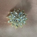 Elegant gold flower brooch with marquise cut crystals on a pink silk background - Snowflake Style (MM-BR-8157)