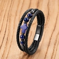 Detail view of multi-layer braided leather bracelet with cross beads on wood surface - Deep Blue Stone Blue Cross (Style-G)