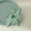 Minimalist square fabric scrunchie in mint green with natural linen texture finish - Matcha Green