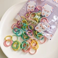 Macro view of colorful elastic hair ties with ribbed texture in a cute bear gift pouch - Small Candy Color Style (5) / Small