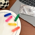 Set of five colorful jelly-colored hair clips in vibrant shades on a ceramic plate - Long Strip Clips