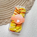 Set de gomas elásticas amarillas y naranjas en caja transparente para peinado infantil - Serie Amarilla
