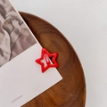 Star shaped hair clip for kids in vibrant red enamel finish on wooden tray - Drip Glue Red