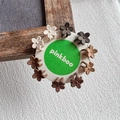 Mini floral matte hair claws in earth tones for kids, presented on a circular card - Small Flower