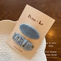 Set of two light blue floral and tweed fabric snap hair clips for girls on display card - Solid Oval and Square Style