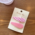 Pink checkered and ribbed fabric hair clips set on display card over wooden desk - Pink Plaid And Solid Pink