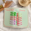Set of 10 colorful matte fruit pattern BB hair clips for girls on a display card - Green With Cherry