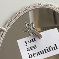 Minimalist silver metal pentagram hair clip on a vintage mirror decorative card - Silver Star Duckbill Clip