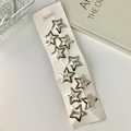 Set mit 10 silbernen hohlen Stern-Haarspangen auf weißer Karte y2k Haarschmuck Accessoires - Silber