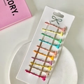 Set mit 10 bunten gewellten Haarklammern in matten Bonbonfarben auf Display-Karte - Wunschflasche Haarnadel