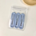 Three matte light blue oval hair clips in transparent packaging with a minimalist aesthetic - Oval Light Blue