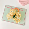 Elastico per capelli con fiocco in tulle giallo floreale su scheda di supporto - Stile Scrunchie / Giallo