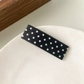 Elegant black hair clip with white polka dots on a minimalist ceramic plate - White Polka Dot