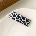 Minimalist rectangular hair clip featuring a black and white cow print patterns - Cow Texture