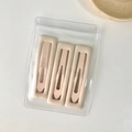 Lot de trois barrettes rectangulaires crème mat dans un sachet de rangement transparent - Rose Chair Carré