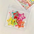 Colorful star-shaped hair clips with polka dot patterns in a transparent retail bag - Large Star