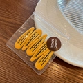 Set of four vibrant yellow candy-colored metal hair clips in handmade packaging - Turmeric