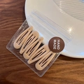 Set of 4 milk tea colored glue-drop BB hair clips in handmade packaging on wood surface - Khaki