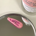 Pink glitter resin hair clip for kids with glossy finish on a reflective mirror surface - Deep Pink