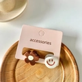 Cute brown flower and white smiley face hair claw clips set on a display card - Flower Smile