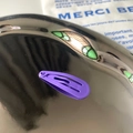 Minimalist purple matte metal teardrop hair clip for kids on a silver display tray - Purple