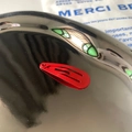 Glossy bright red 3cm metal BB hair clip for girls shown on a textured silver tray - Red
