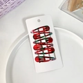 Set of six red and green plaid teardrop snap hair clips on a white display card - Red Green Tartan Style